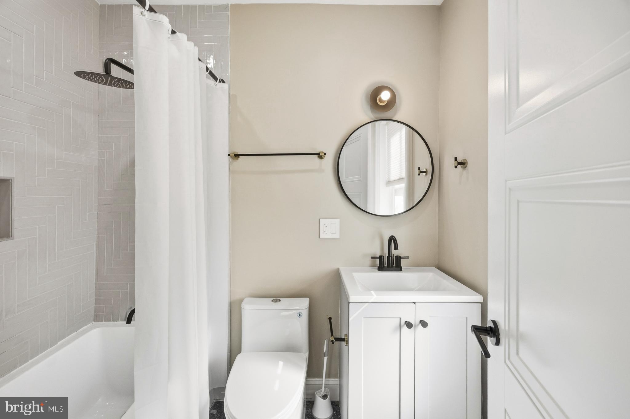 552 North 18th Street Philadelphia, PA 19130 - Photo 46 of 51 a bathroom with a toilet sink and mirror