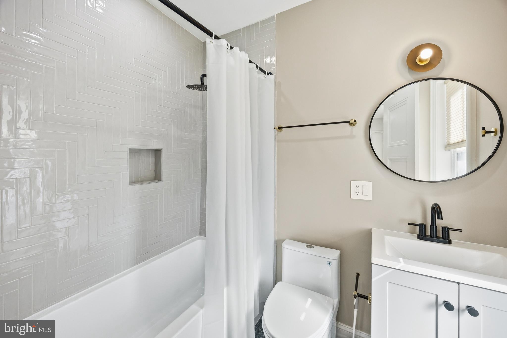 552 North 18th Street Philadelphia, PA 19130 - Photo 47 of 51 a bathroom with a sink a toilet and a mirror