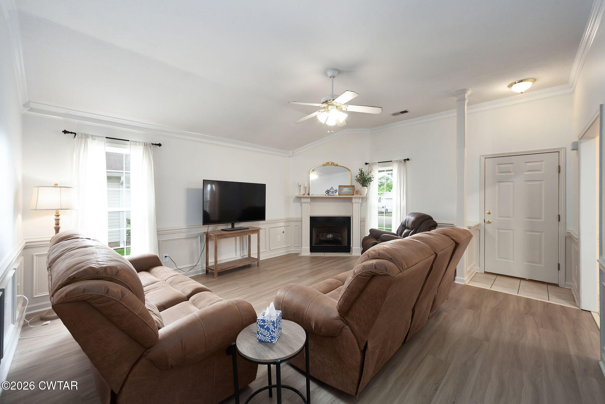 80 Rooker Drive Jackson, TN 38305 - Photo 6 of 30 a living room with furniture a fireplace and a flat screen tv