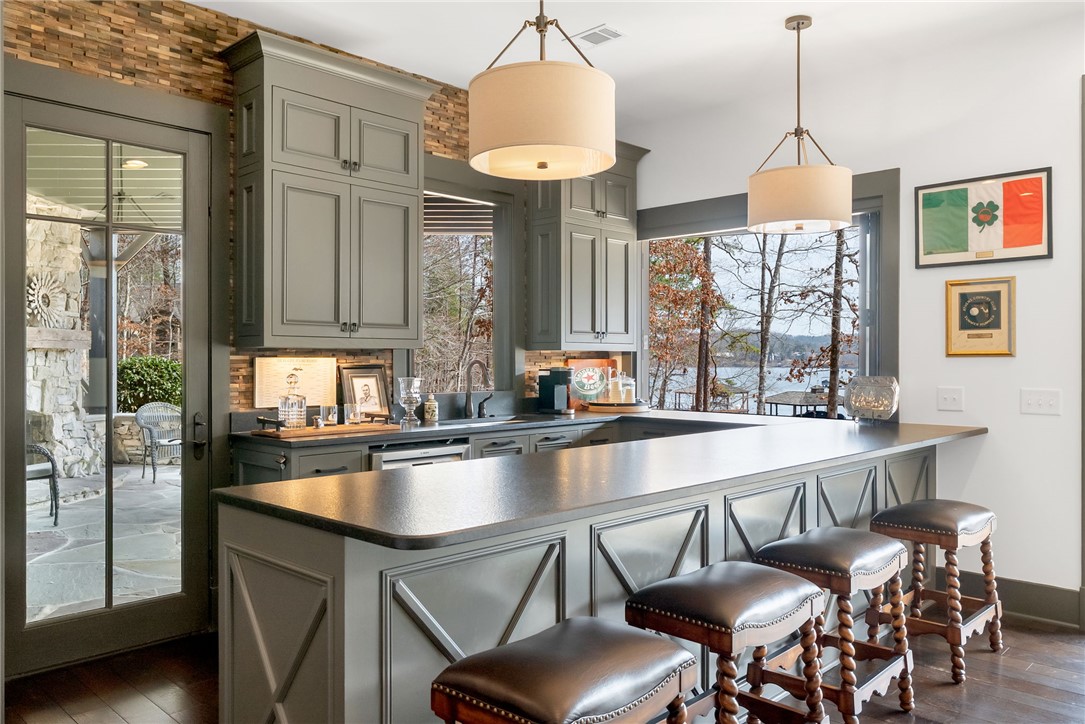 231 Quay Court Sunset, SC 29685 - Photo 28 of 48 Bar with full Refrigerator, sink on Lower Level, walk out deck and Lake Keowee