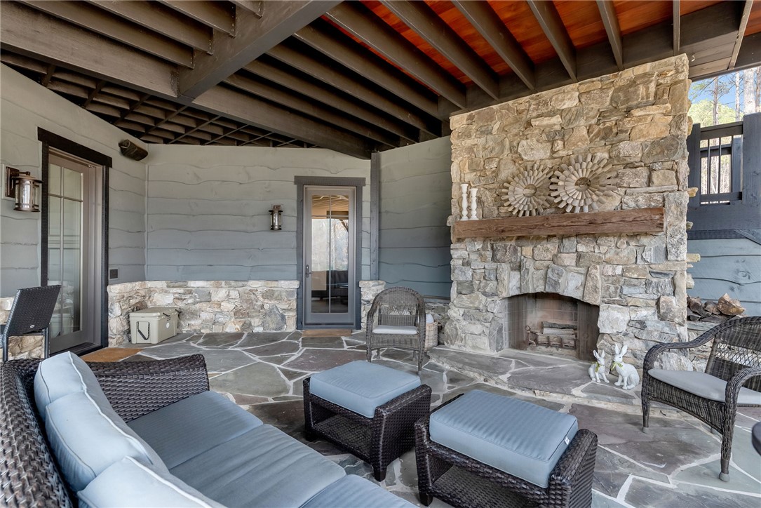 231 Quay Court Sunset, SC 29685 - Photo 32 of 48 Third Fireplace with Lake Views and large entertaining space off of Lower Level bar