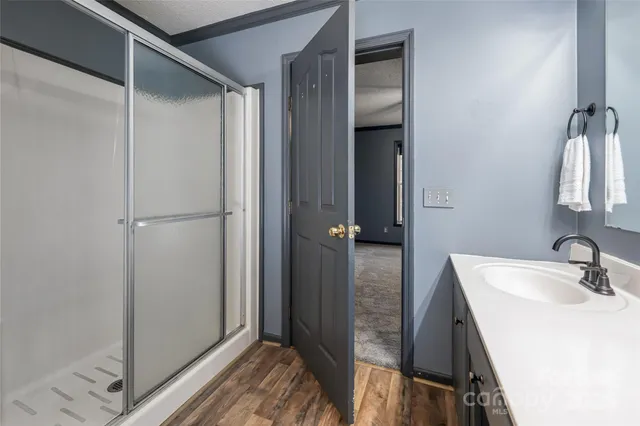 a bathroom with a sink and mirror