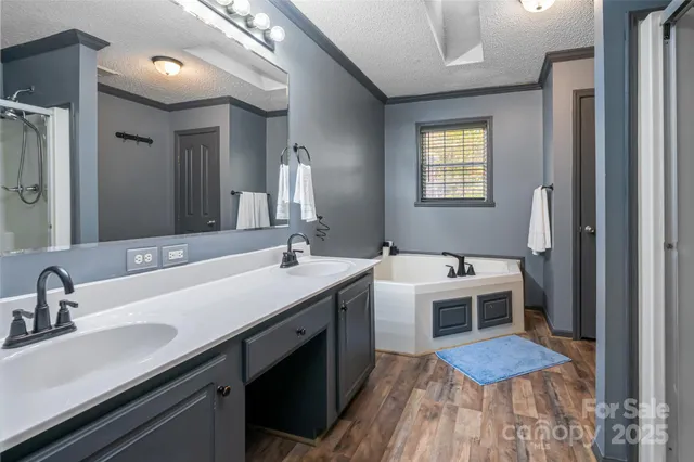 a spacious bathroom with a double vanity sink and a mirror