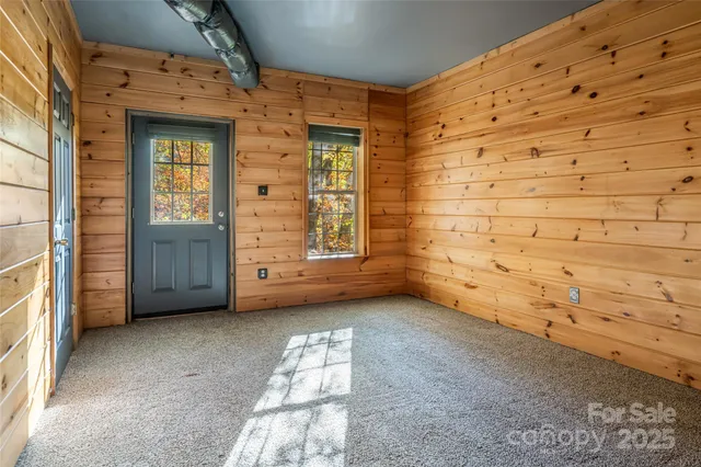 a view of an empty room with windows