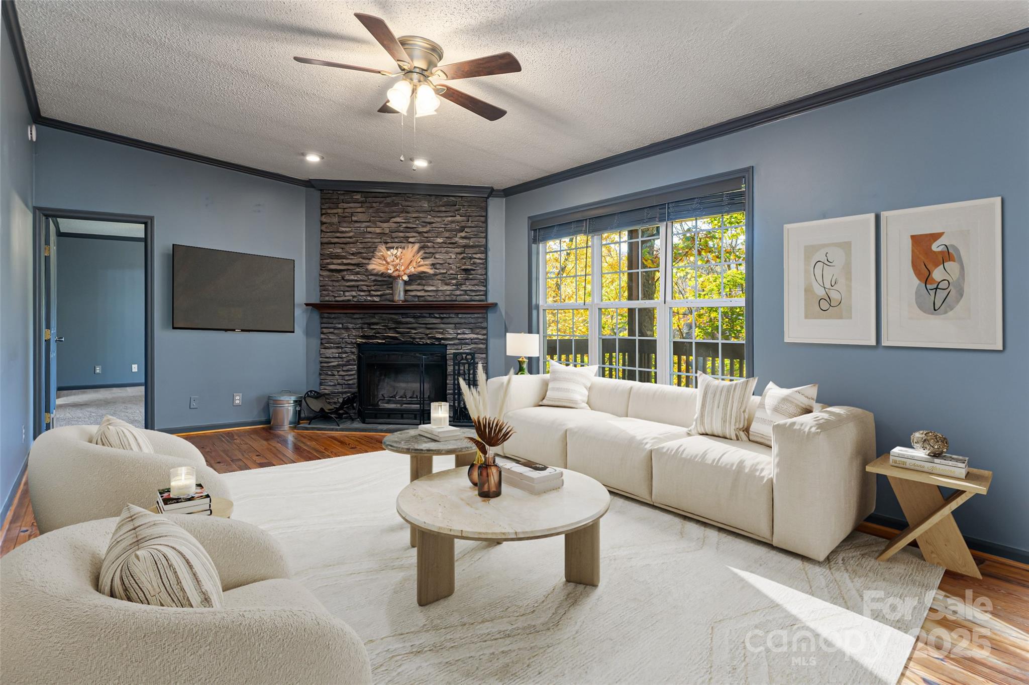 334 Foxden Road Mars Hill, NC 28754 - Photo 3 of 43 a living room with furniture a large window and a fireplace