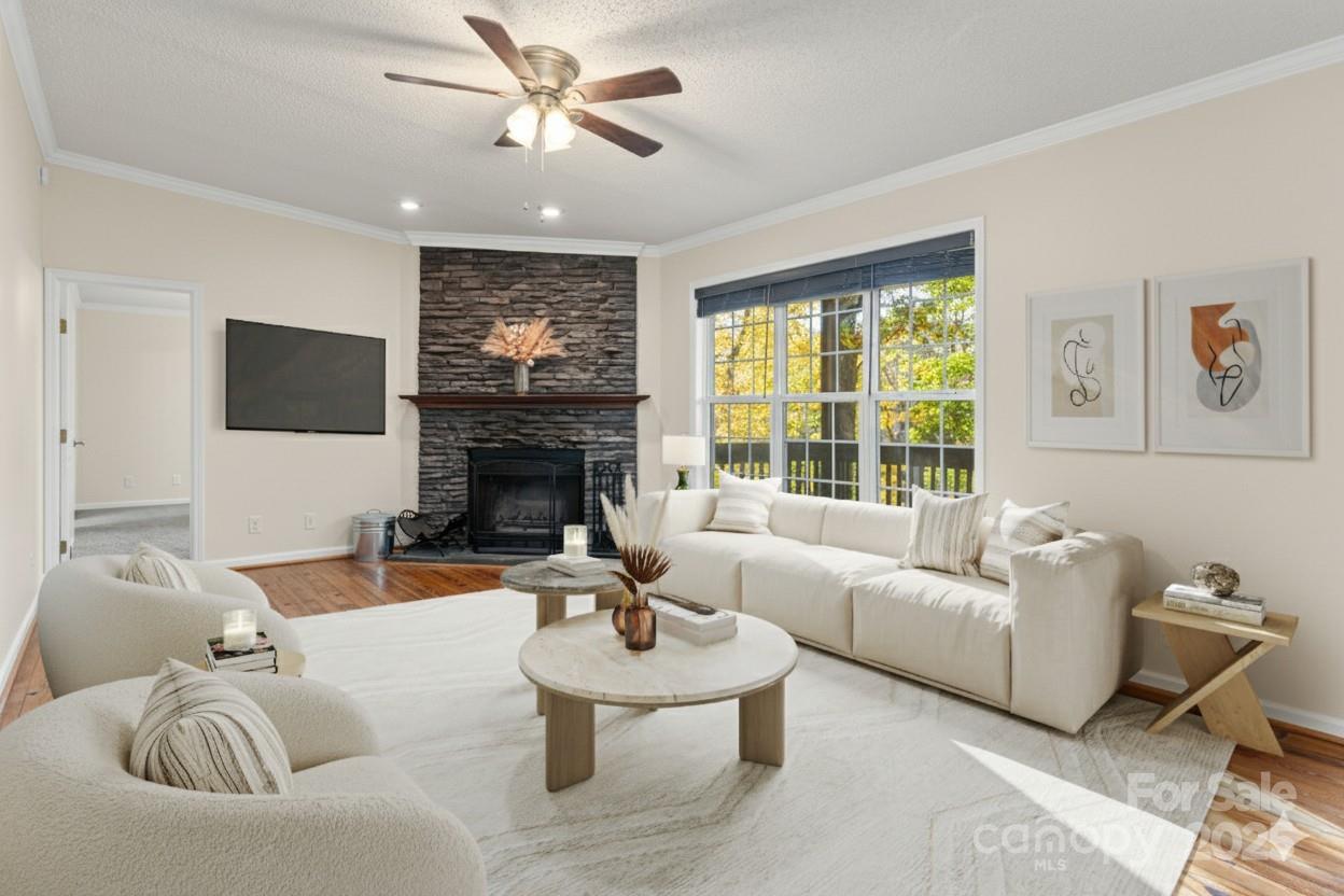 334 Foxden Road Mars Hill, NC 28754 - Photo 4 of 43 a living room with furniture a fireplace and a flat screen tv