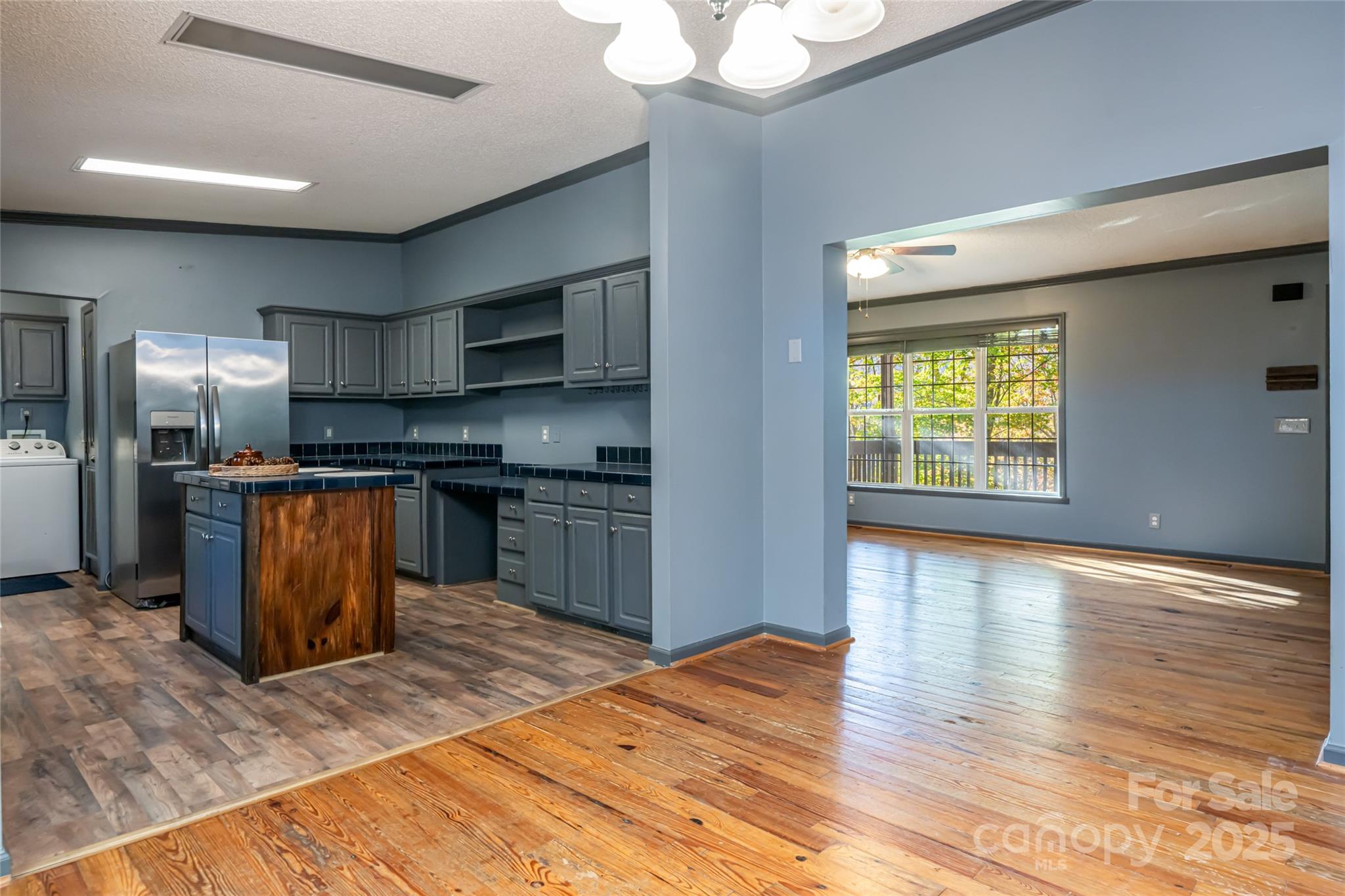 334 Foxden Road Mars Hill, NC 28754 - Photo 6 of 43 a kitchen with stainless steel appliances granite countertop a refrigerator a sink a stove and oven
