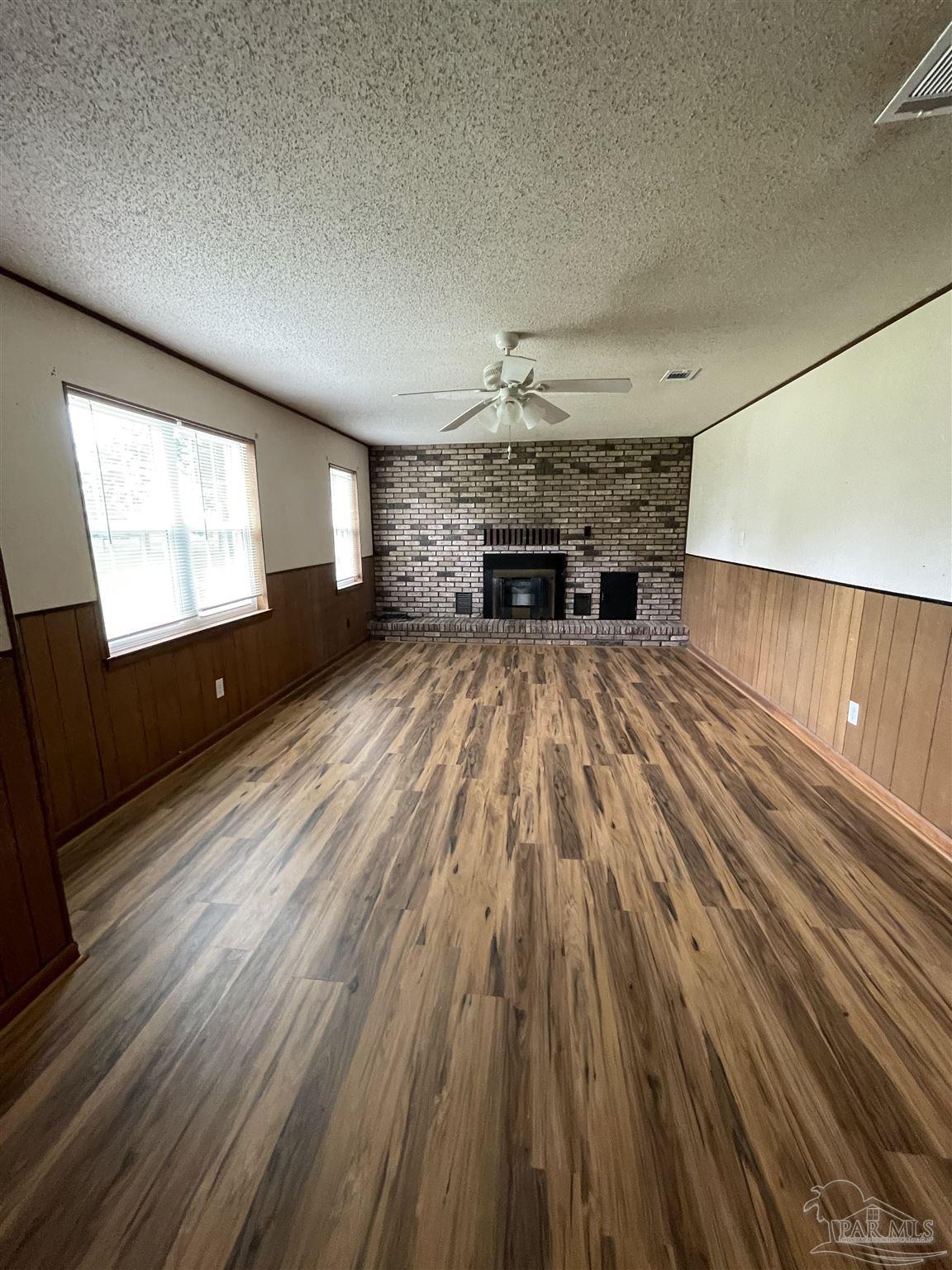 9550 Highway 89 Milton, FL 32570 - Photo 4 of 18 a view of kitchen and hall with wooden floor