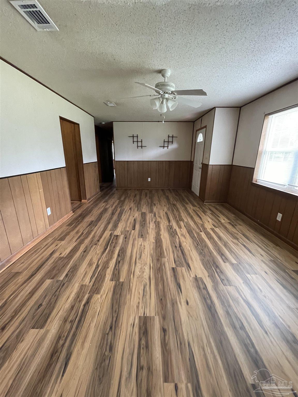 9550 Highway 89 Milton, FL 32570 - Photo 5 of 18 a view of empty room with wooden floor