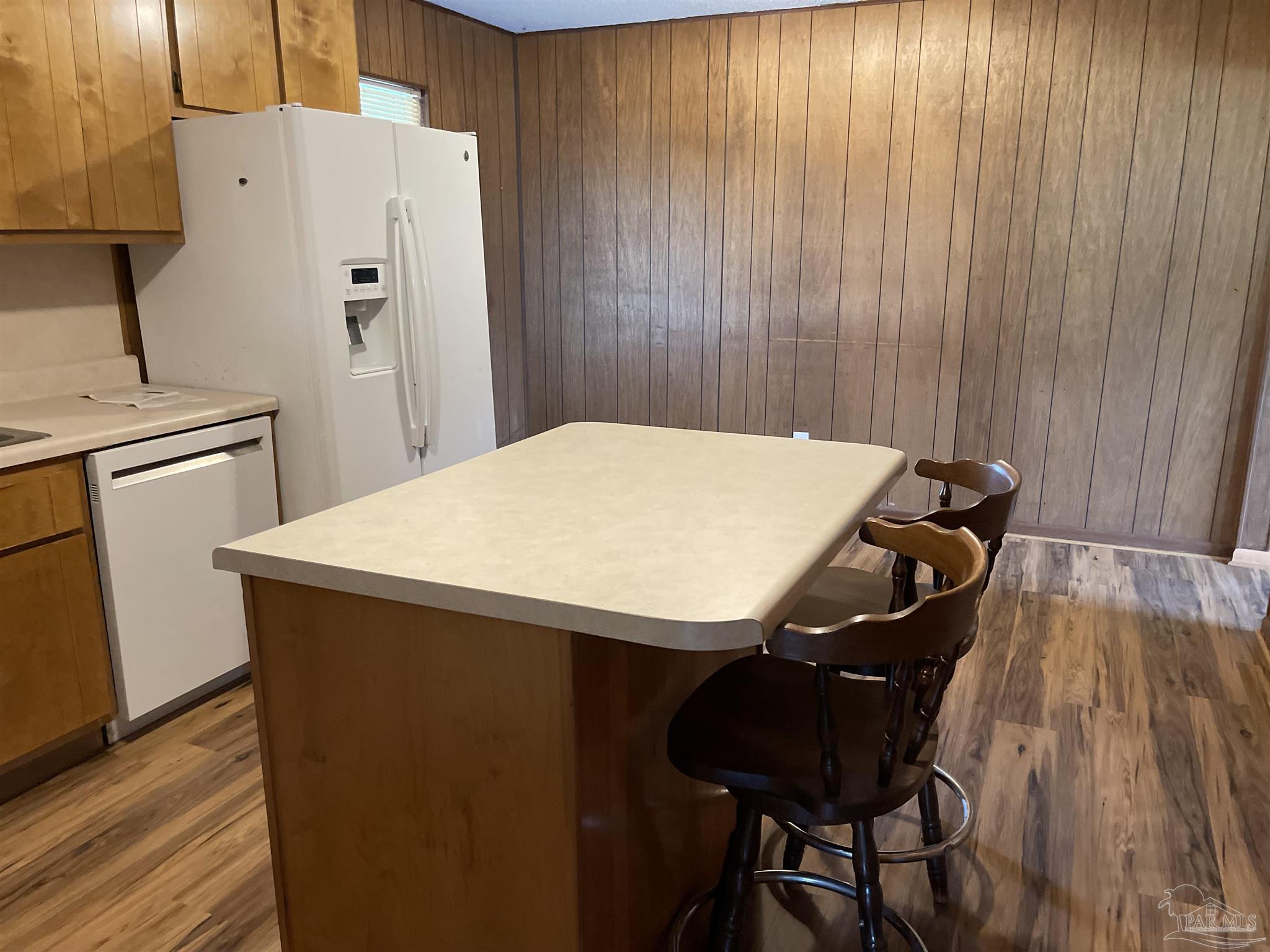 9550 Highway 89 Milton, FL 32570 - Photo 7 of 18 a close view of a sink and dishwasher with wooden floor