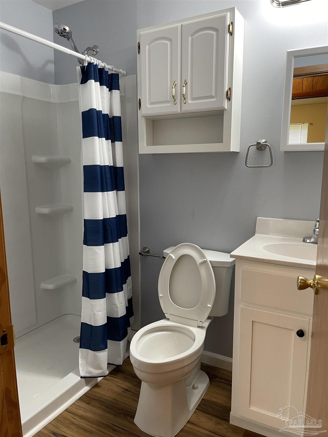 9550 Highway 89 Milton, FL 32570 - Photo 9 of 18 a bathroom with a toilet and a shower