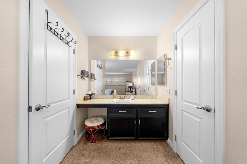 4363 Country Trails Lane Bonita, CA 91902 - Photo 16 of 27 a bathroom with a double vanity sink and mirror with shower