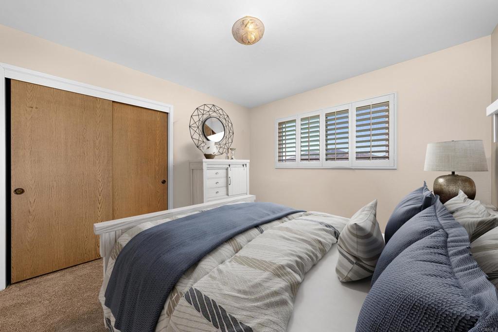 4363 Country Trails Lane Bonita, CA 91902 - Photo 18 of 27 a bedroom with a bed and a window