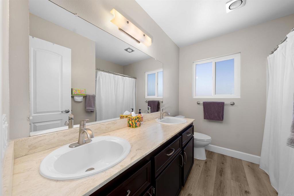 4363 Country Trails Lane Bonita, CA 91902 - Photo 19 of 27 a bathroom with a sink double vanity and a mirror