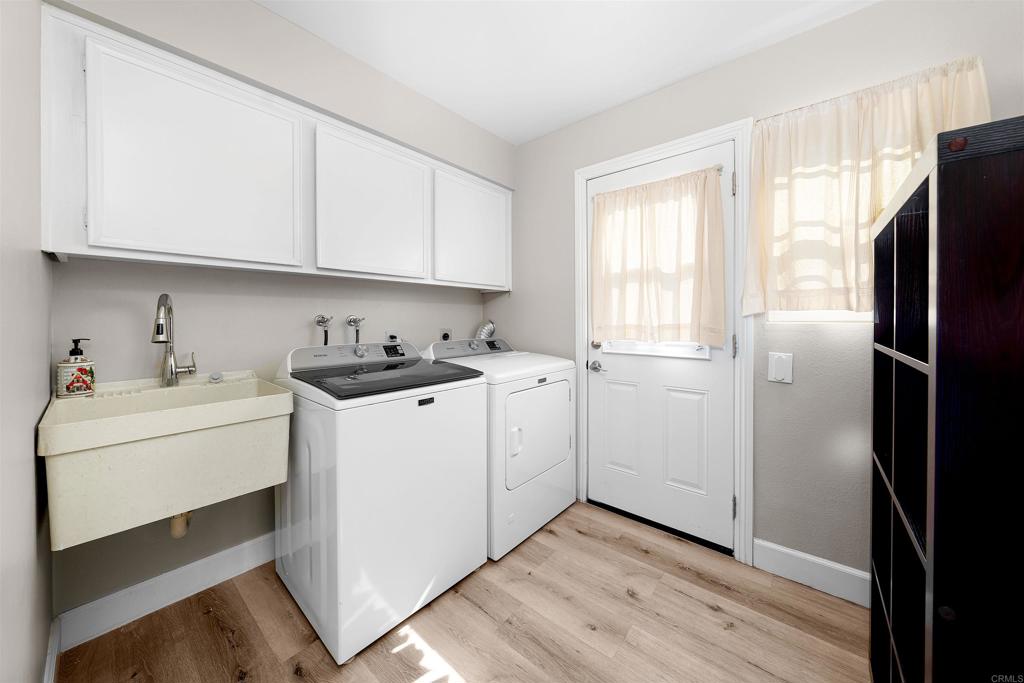 4363 Country Trails Lane Bonita, CA 91902 - Photo 20 of 27 a kitchen with stainless steel appliances white cabinets and a refrigerator