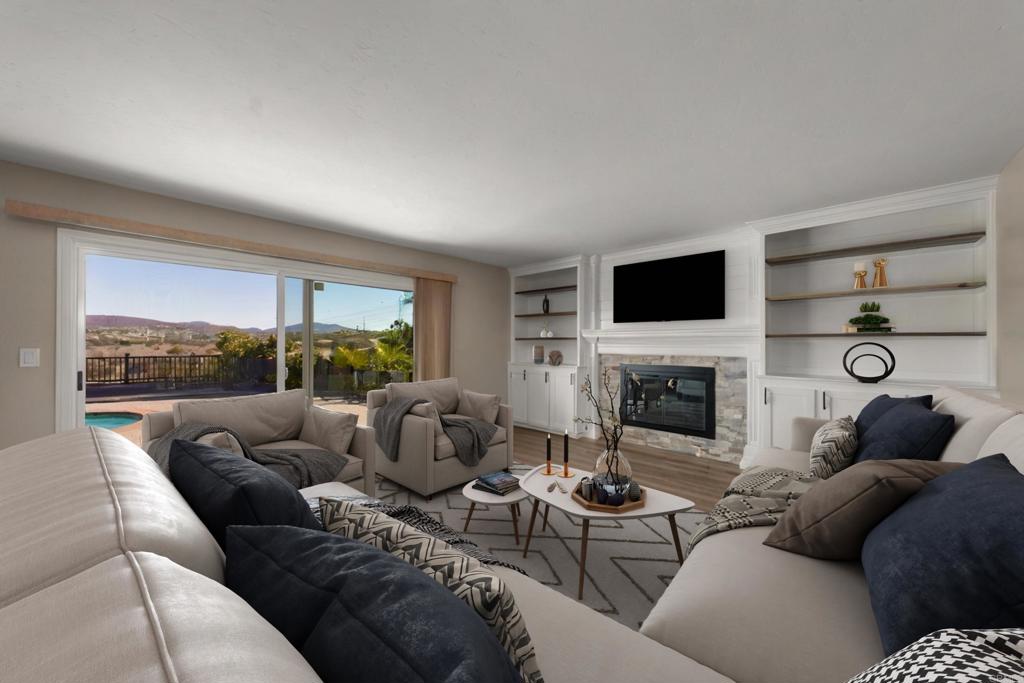 4363 Country Trails Lane Bonita, CA 91902 - Photo 4 of 27 a living room with furniture a fireplace and a floor to ceiling window
