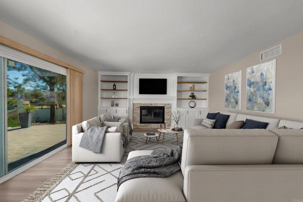4363 Country Trails Lane Bonita, CA 91902 - Photo 5 of 27 a living room with furniture a large window and a fireplace