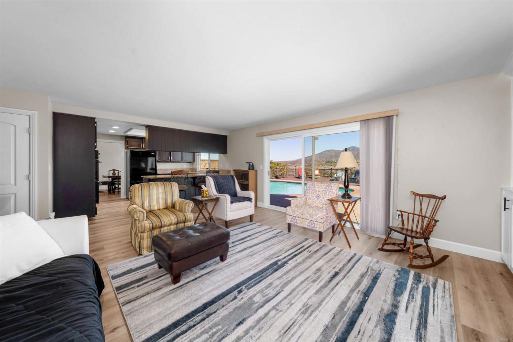4363 Country Trails Lane Bonita, CA 91902 - Photo 6 of 27 a living room with furniture and a wooden floor