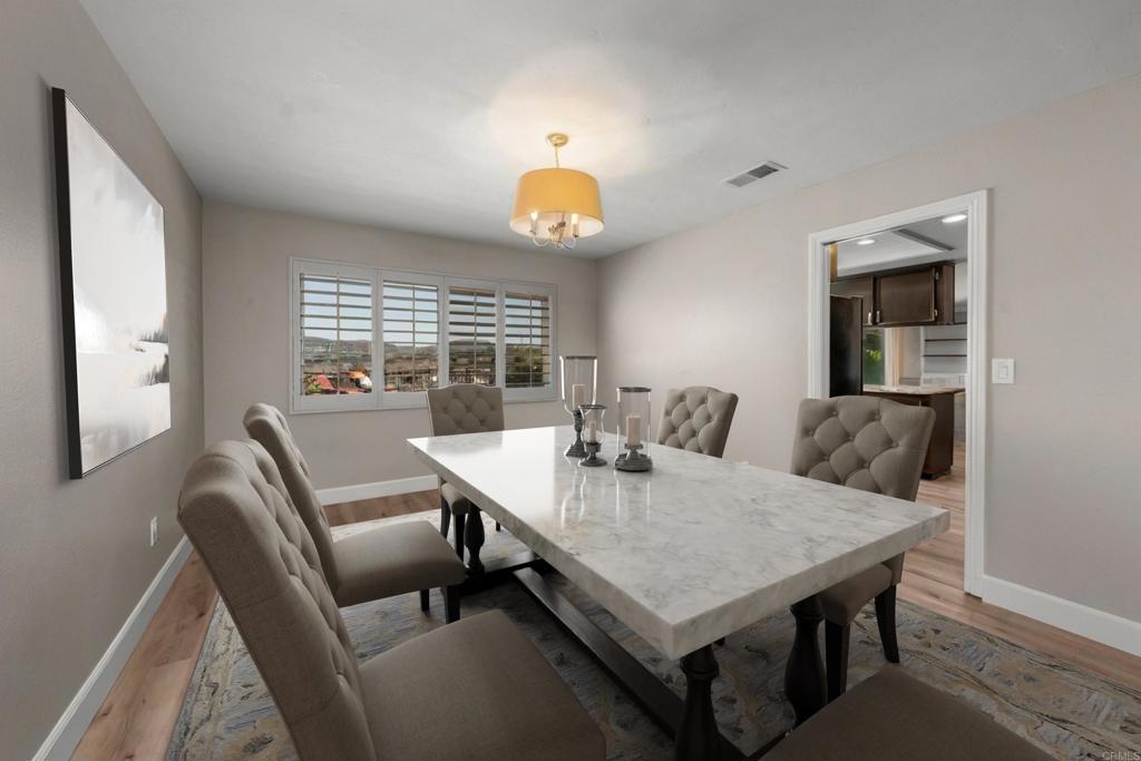 4363 Country Trails Lane Bonita, CA 91902 - Photo 10 of 27 a view of a dining room with furniture and chandelier