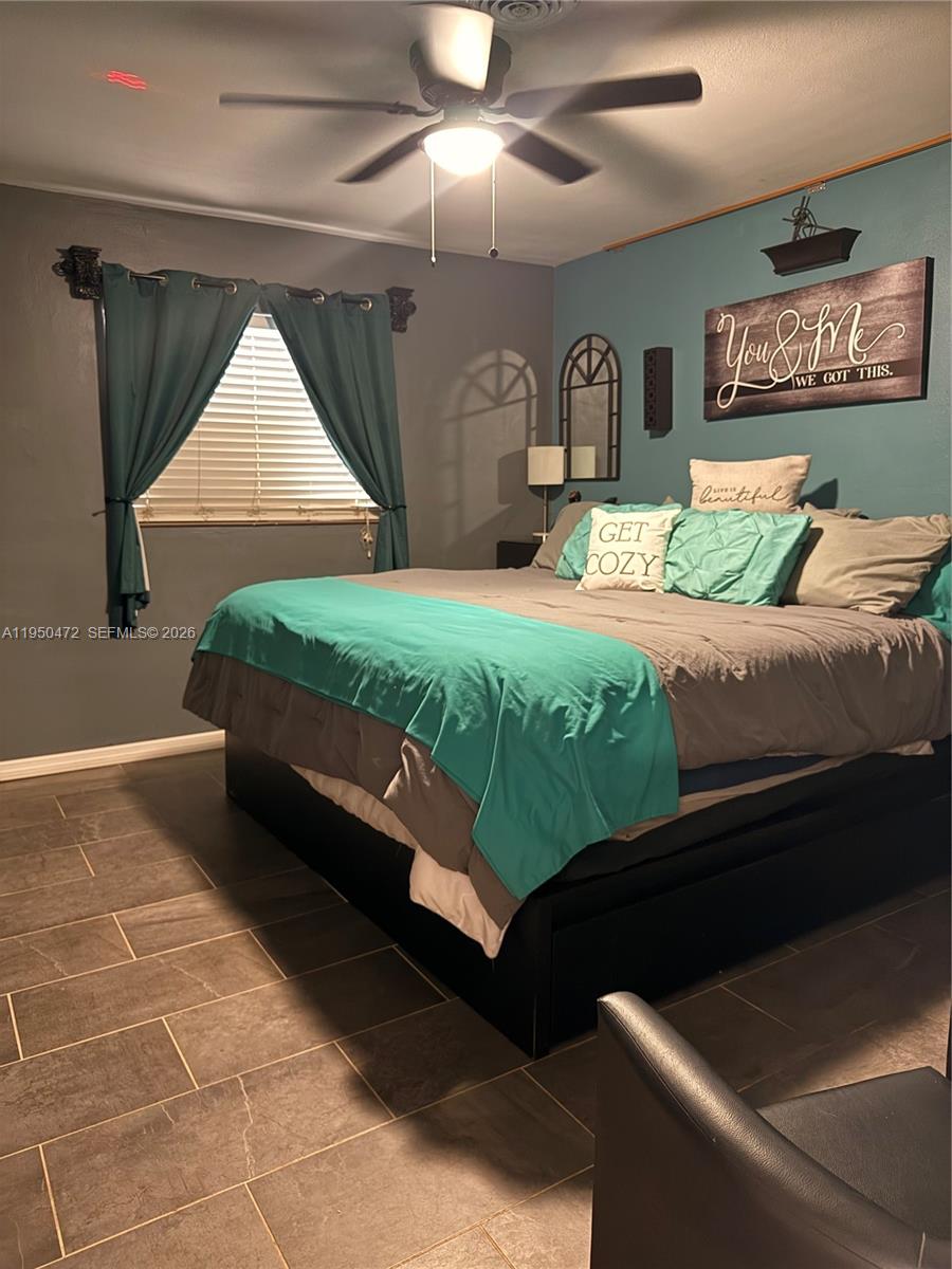 309 Northwest 15th Street Homestead, FL 33030 - Photo 13 of 19 a bed room with a bed and a television
