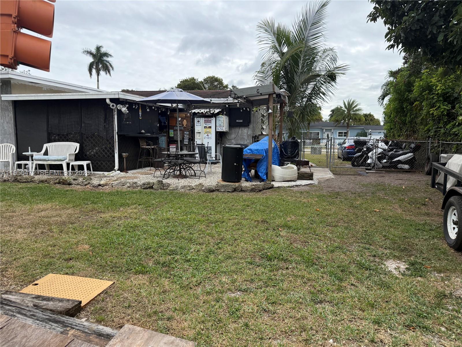 309 Northwest 15th Street Homestead, FL 33030 - Photo 17 of 19 a view of a house with backyard porch and sitting area