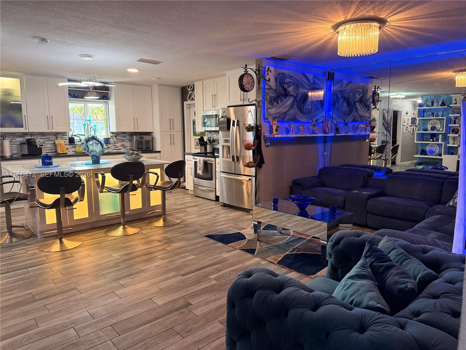 309 Northwest 15th Street Homestead, FL 33030 - Photo 6 of 19 a living room with furniture and wooden floor