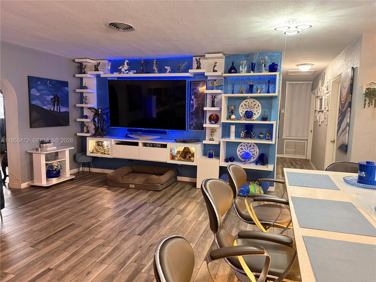 309 Northwest 15th Street Homestead, FL 33030 - Photo 7 of 19 a living room with lots of furniture and a flat screen tv