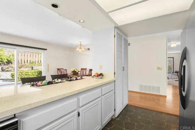 a spacious bathroom with a double vanity sink a mirror and a shower