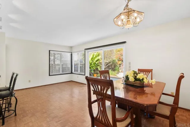 a view of a dining room with furniture window and outside view