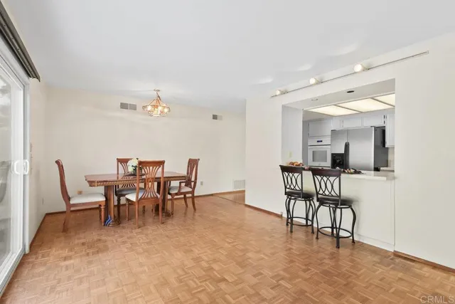 a dining room with furniture and window