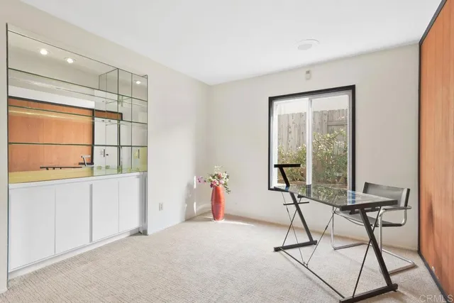 a room with a table and chairs