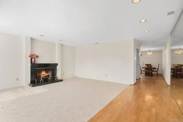 a view of a livingroom and a fireplace