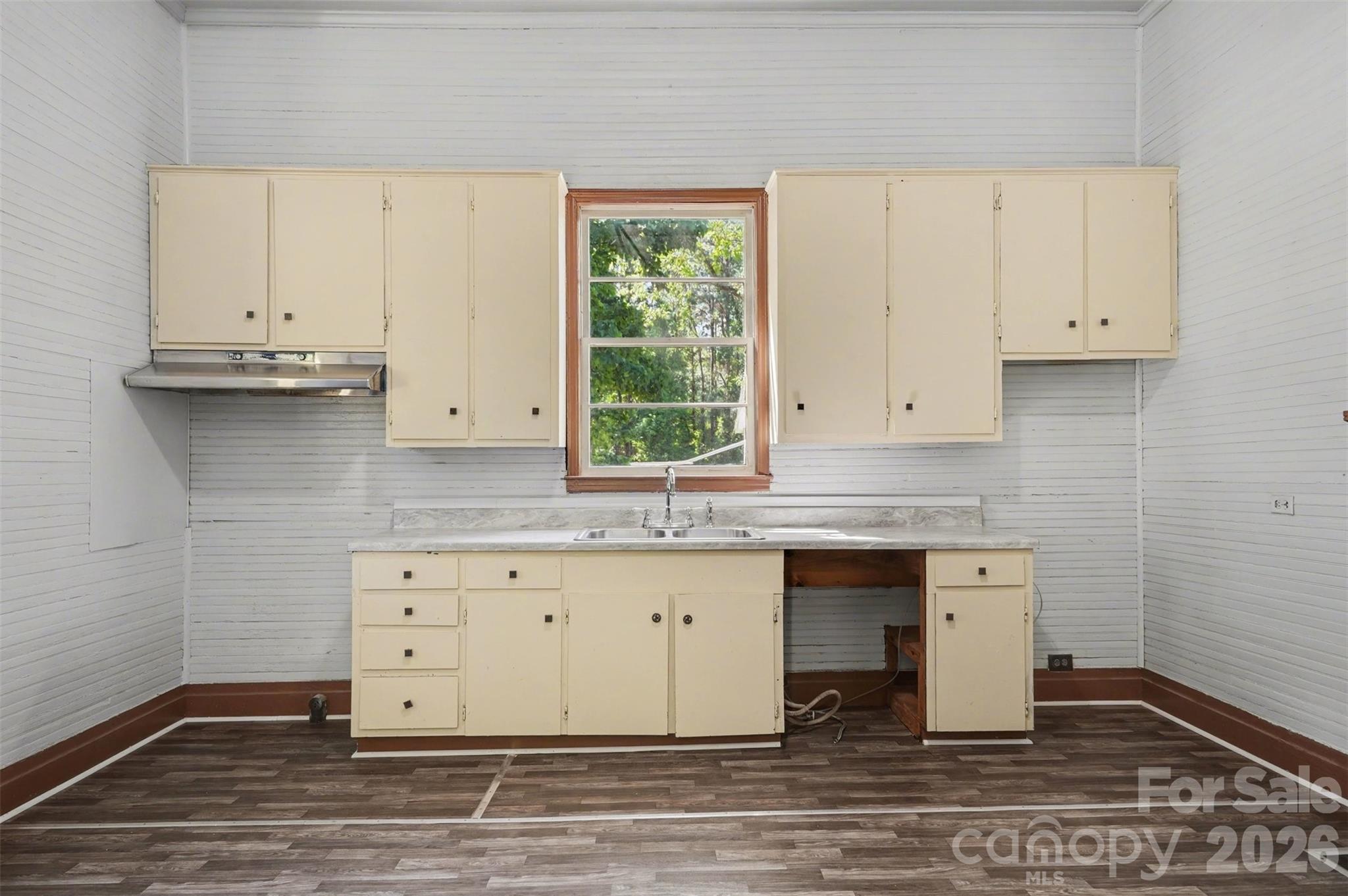 215 Theodore R Carr Avenue Morven, NC 28119 - Photo 14 of 28 a kitchen with granite countertop a sink cabinets and wooden floor
