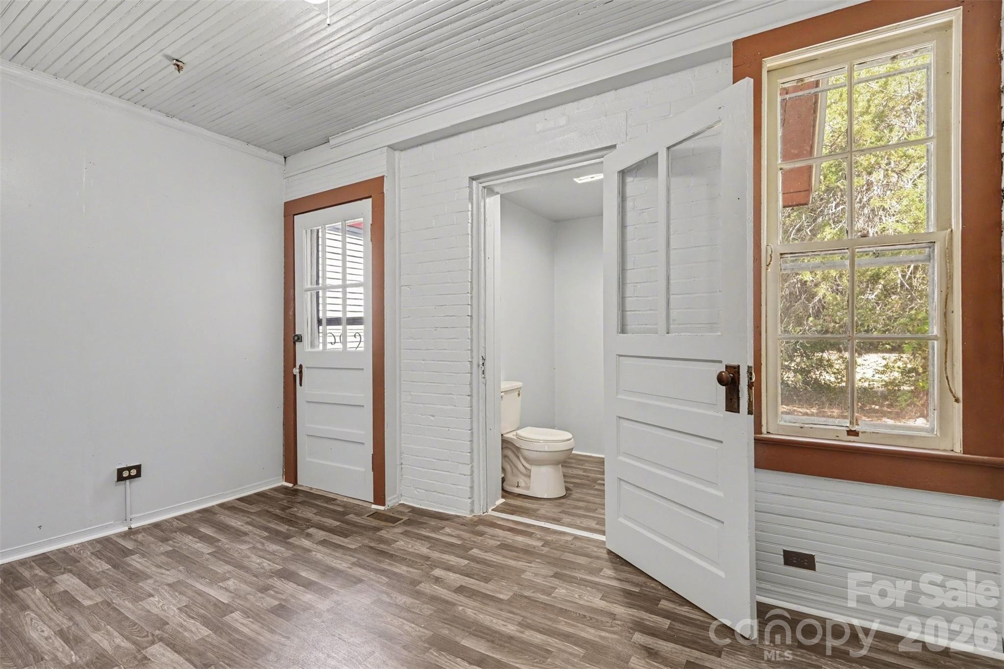 215 Theodore R Carr Avenue Morven, NC 28119 - Photo 18 of 28 a bathroom with a toilet sink and a shower