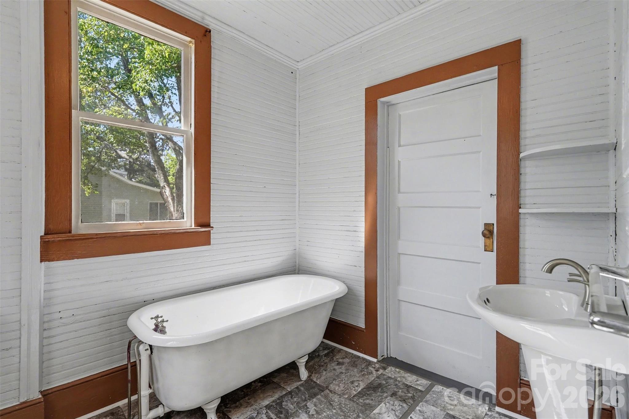 215 Theodore R Carr Avenue Morven, NC 28119 - Photo 19 of 28 a bathroom with a toilet a sink and a window