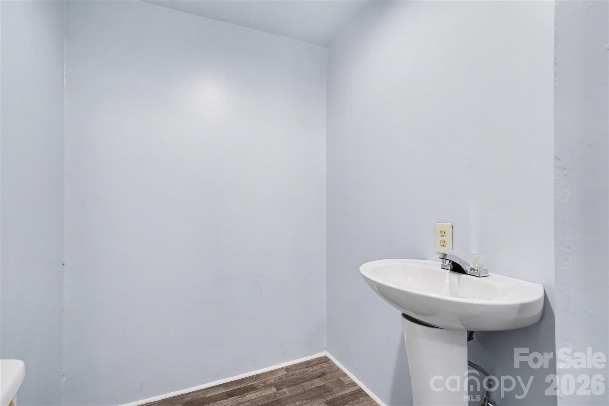 215 Theodore R Carr Avenue Morven, NC 28119 - Photo 21 of 28 a bathroom with a sink and mirror