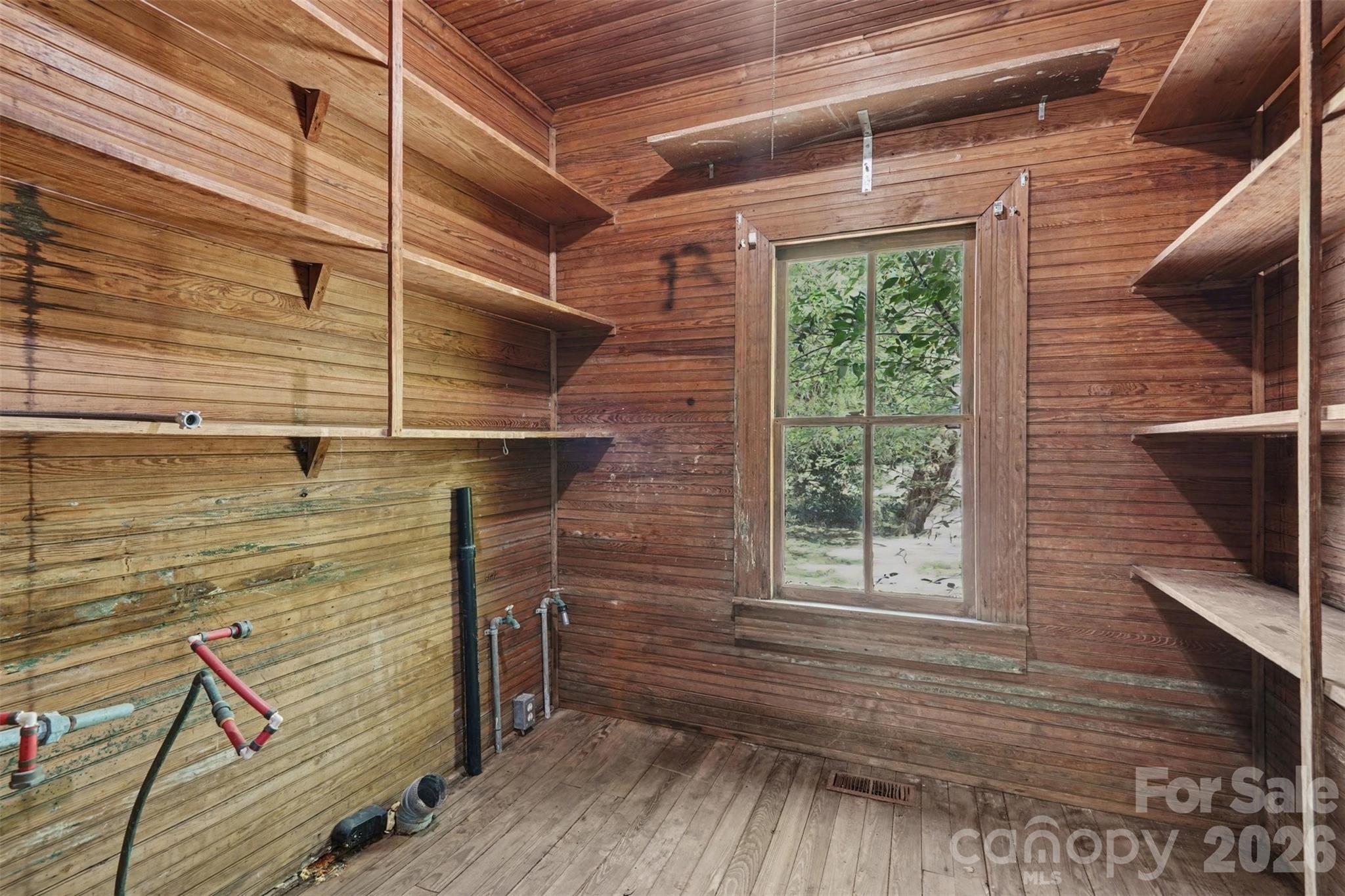 215 Theodore R Carr Avenue Morven, NC 28119 - Photo 24 of 28 a view of a room with wooden floor and windows