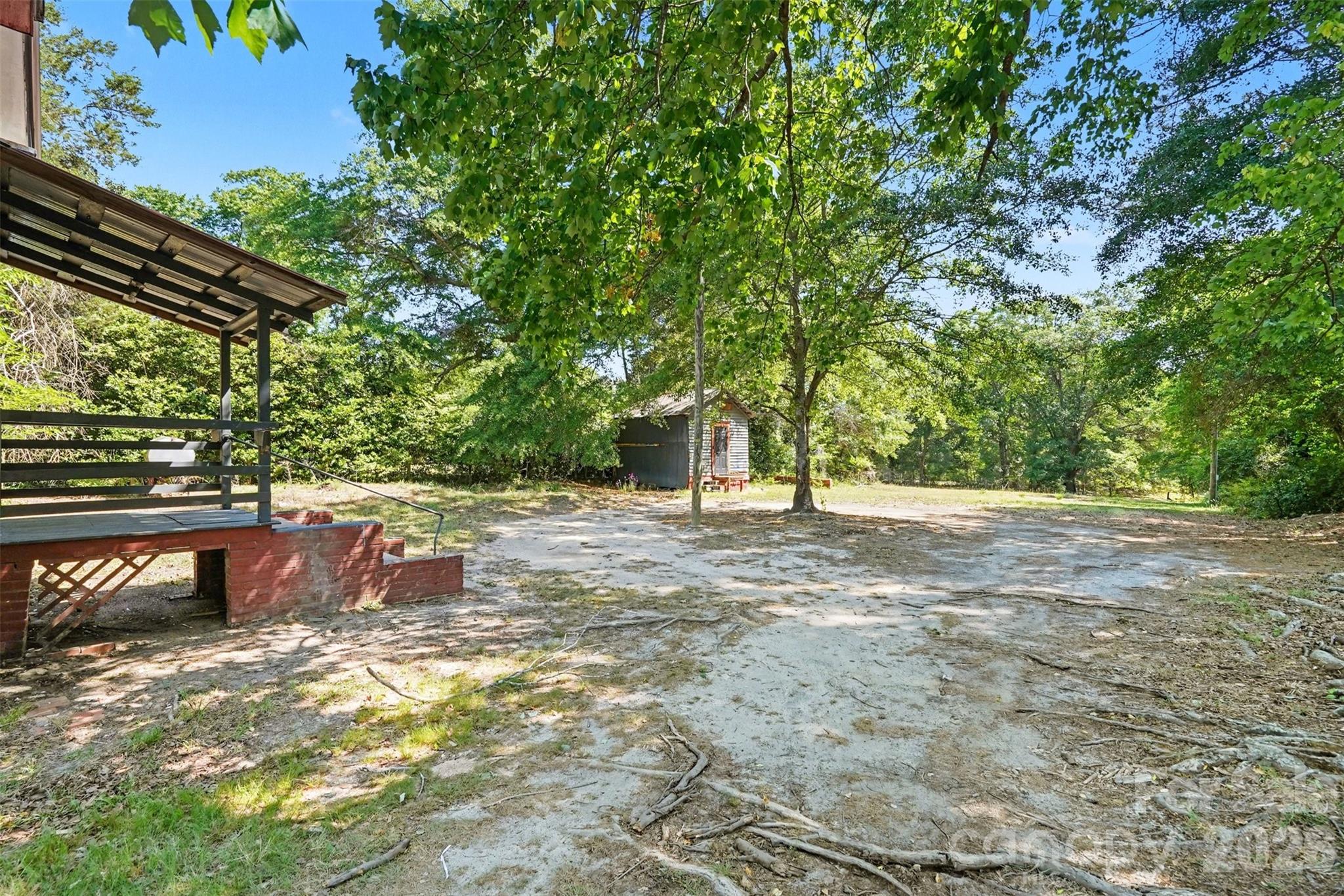 215 Theodore R Carr Avenue Morven, NC 28119 - Photo 28 of 28 a view of backyard with outdoor and green space