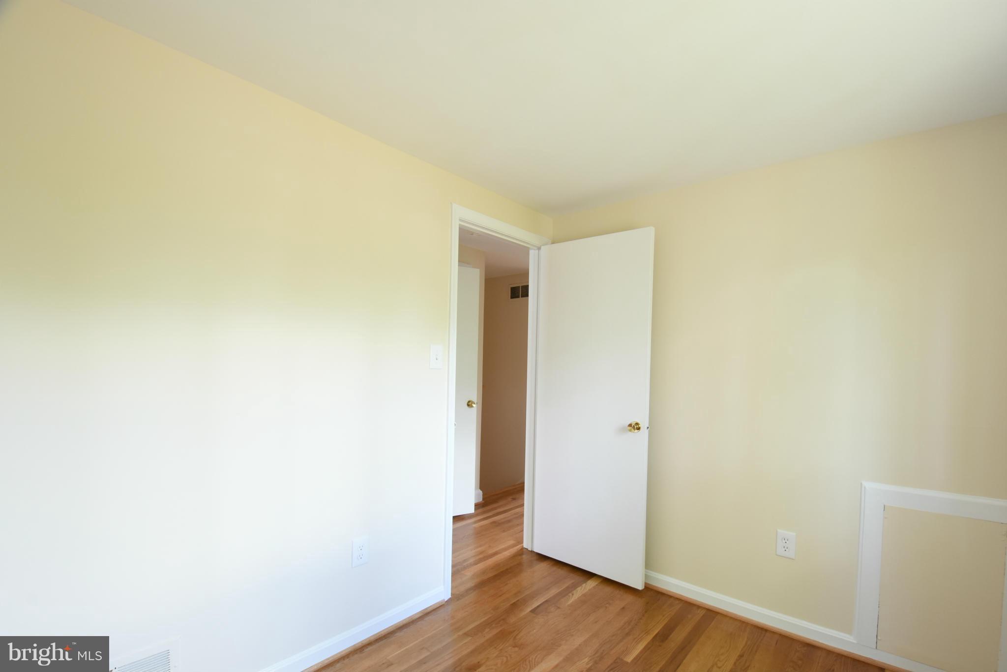 5607 Rolling Road Springfield, VA 22151 - Photo 18 of 30 a view of an empty room with wooden floor