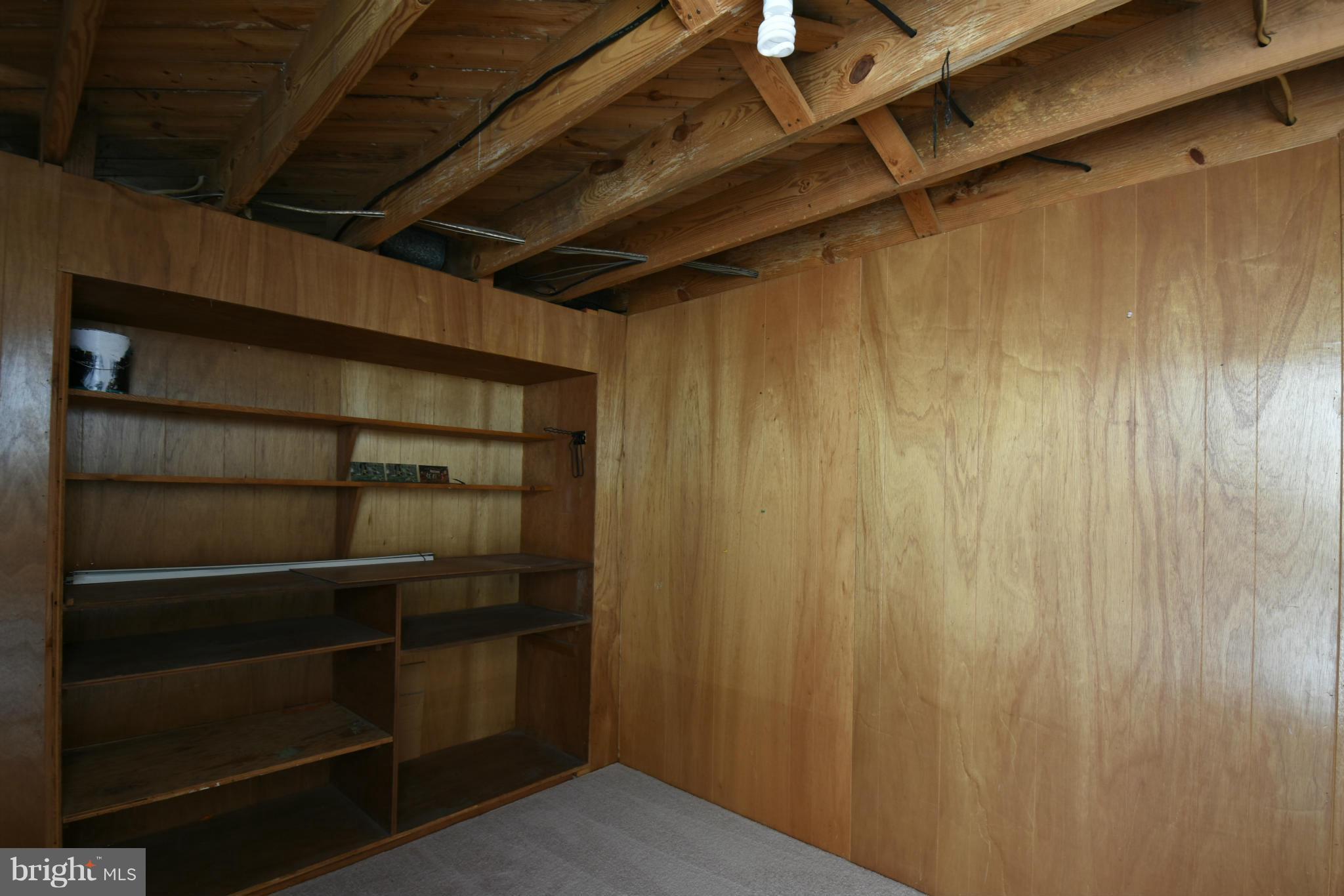 5607 Rolling Road Springfield, VA 22151 - Photo 24 of 30 a view of walk in closet with empty racks