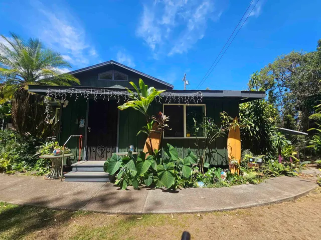 a bedroom with furniture and a lamp