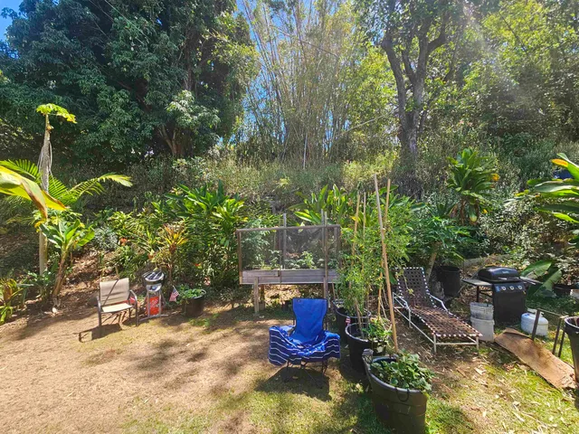 a kitchen with stainless steel appliances granite countertop a stove a refrigerator and a microwave