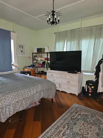 a bathroom with a shower and a toilet