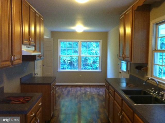 5130 Partlow Road Partlow, VA 22534 - Photo 3 of 10 a kitchen that has a sink a stove and a window