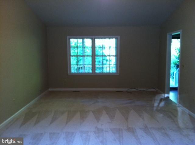 5130 Partlow Road Partlow, VA 22534 - Photo 7 of 10 a view of an empty room with wooden floor and a window