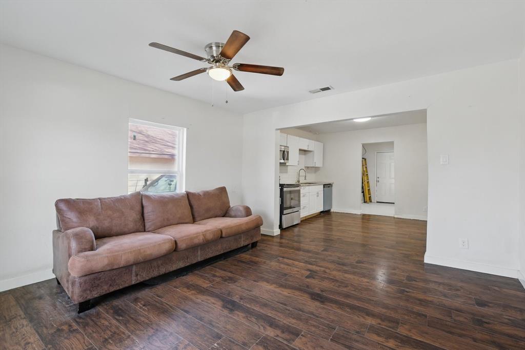 1805 Daniel Street Fort Worth, TX 76104 - Photo 14 of 38 a living room with furniture and a view of kitchen