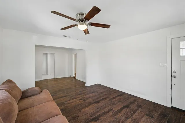a view of room with window and ceiling fan