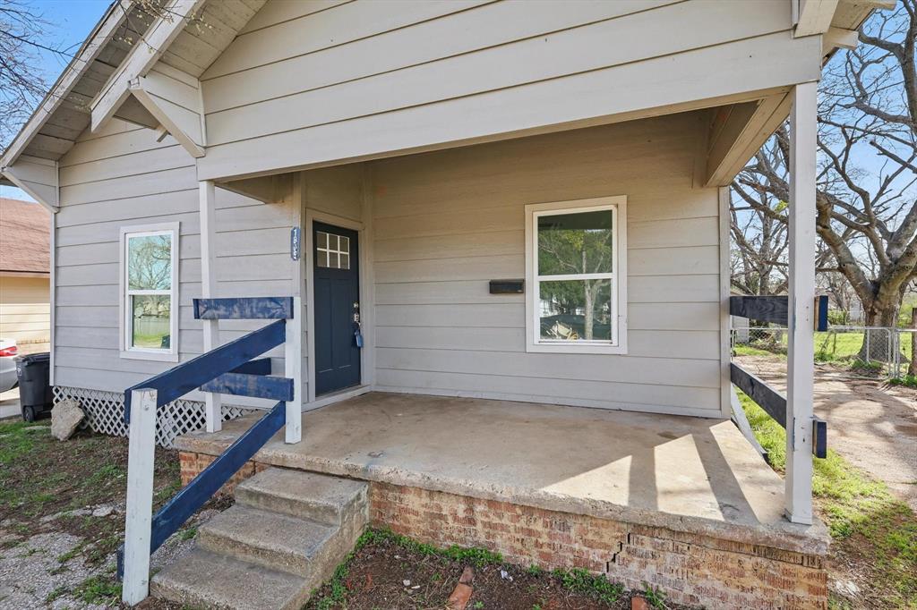 1805 Daniel Street Fort Worth, TX 76104 - Photo 2 of 38 a front view of a house with a yard