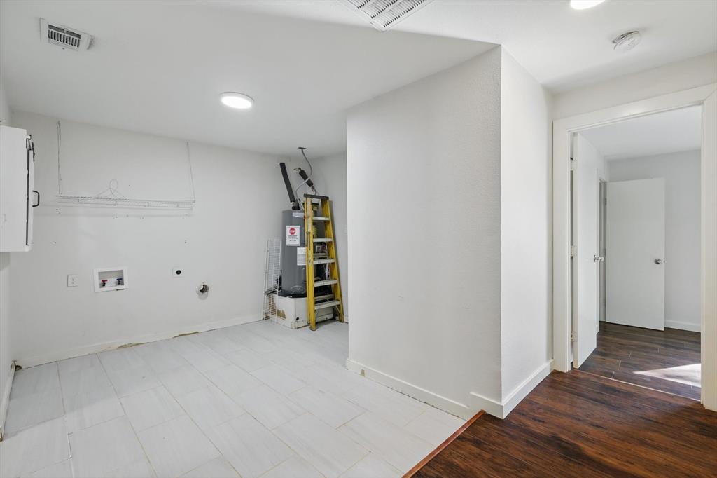 1805 Daniel Street Fort Worth, TX 76104 - Photo 33 of 38 an empty room with wooden floor and closet
