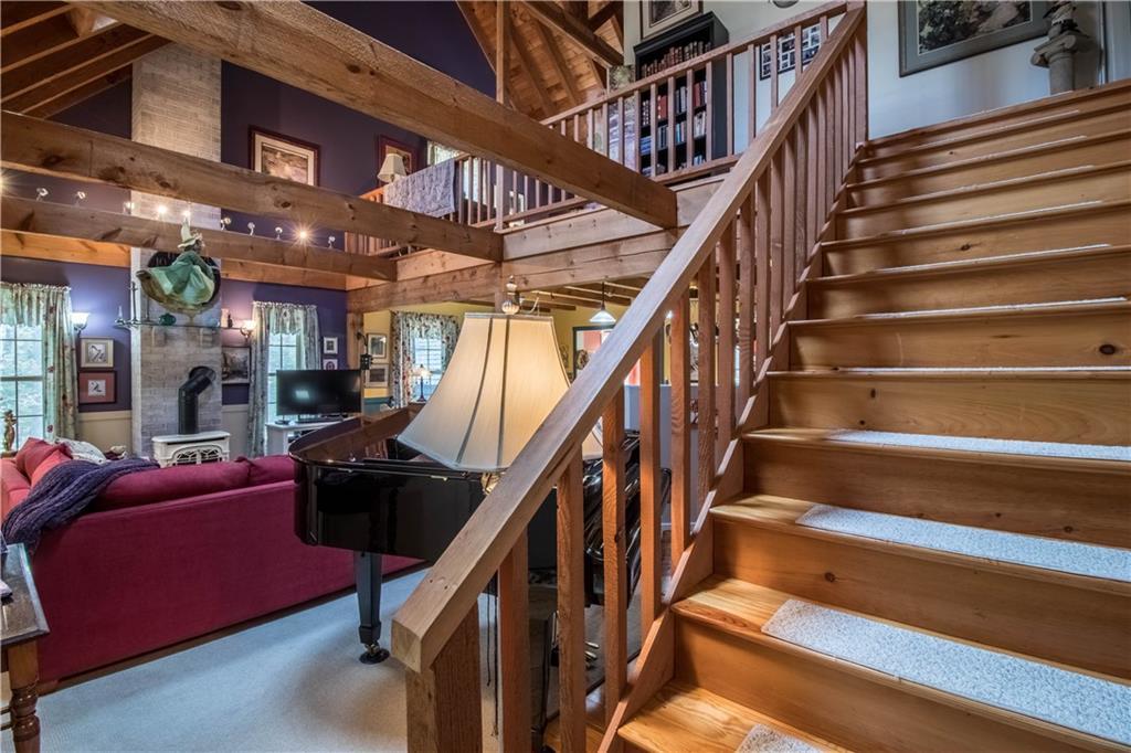 156 Indian Road Wiscasset, ME 04578 - Photo 15 of 31 Open stairs lead up to second floor...